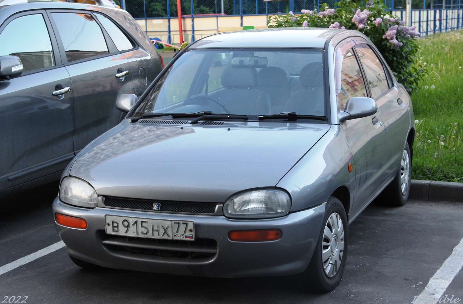 в 915 нх 77, Autozam Revue 