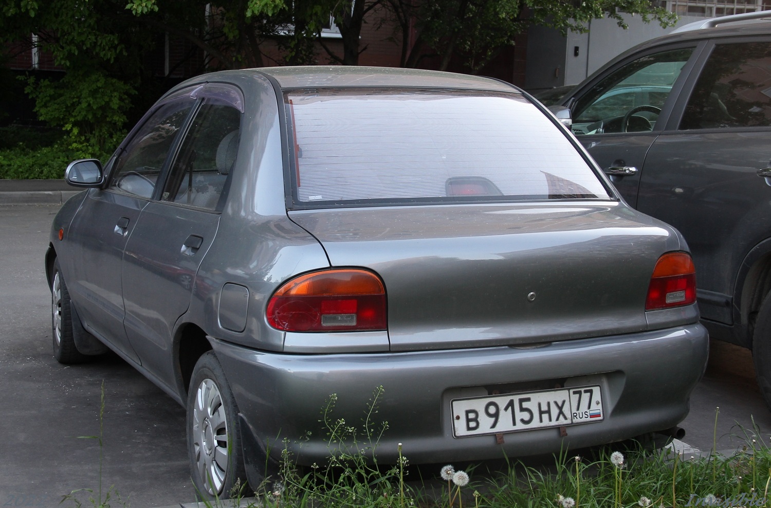 в 915 нх 77, Autozam Revue 