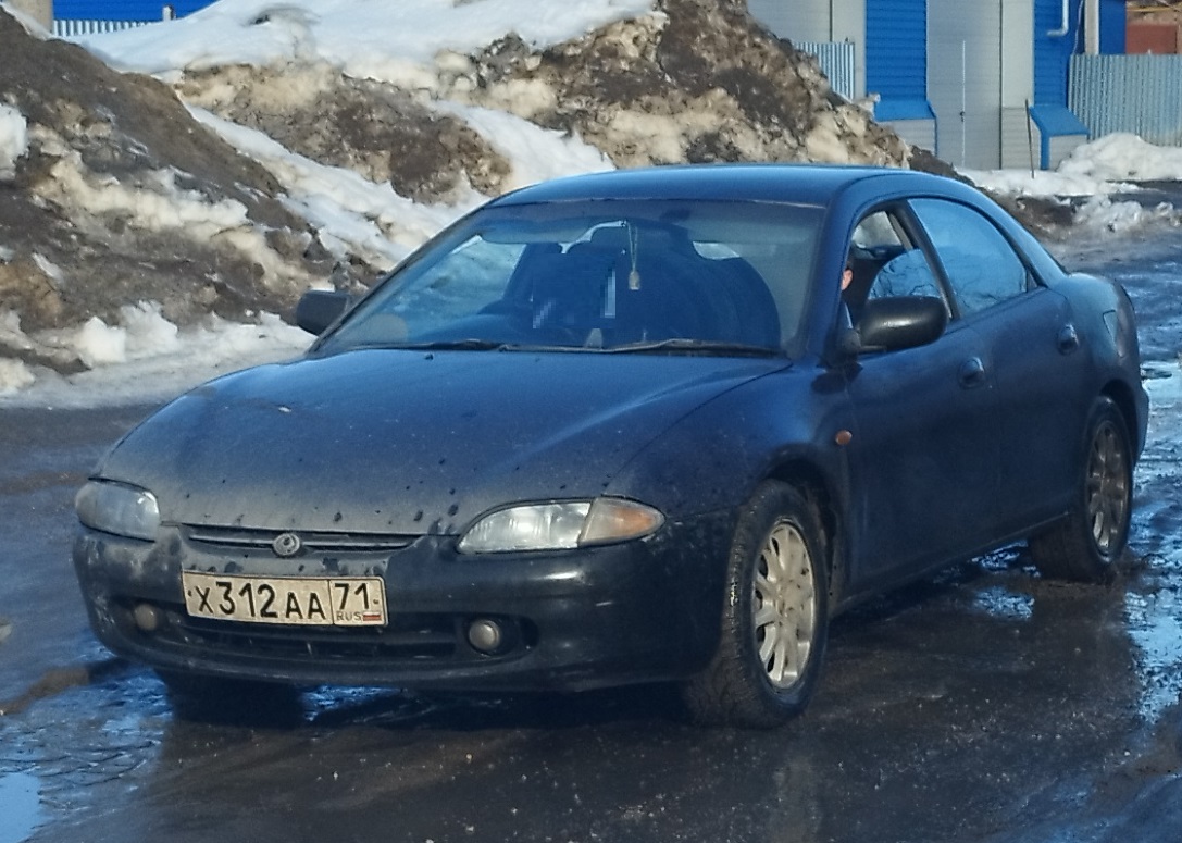 х 312 аа 71, Mazda Lantis 1st gen Sedan (CB), 1993–1997