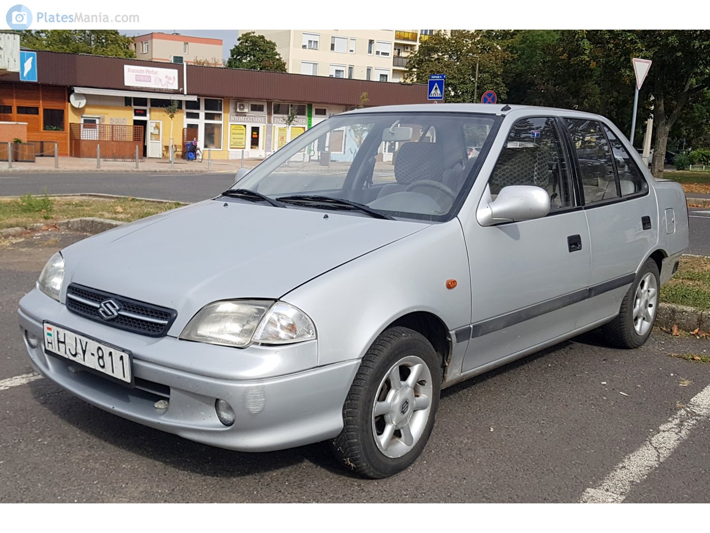 HJY-811, Suzuki Swift 2nd gen Sedan (SF), facelift, 1996–2004