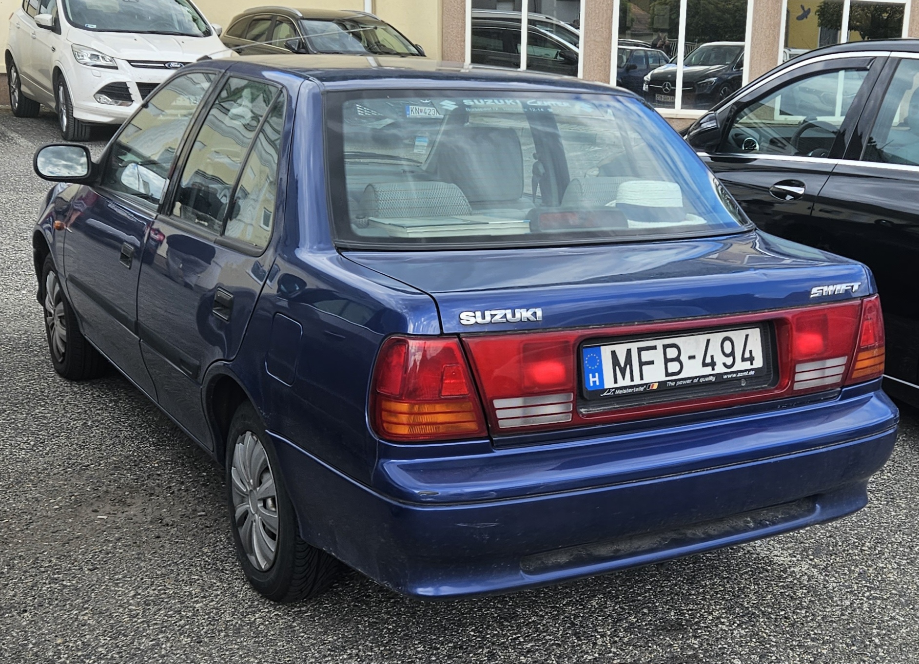MFB-494, Suzuki Swift 2nd gen Sedan (SF), facelift, 1996–2004