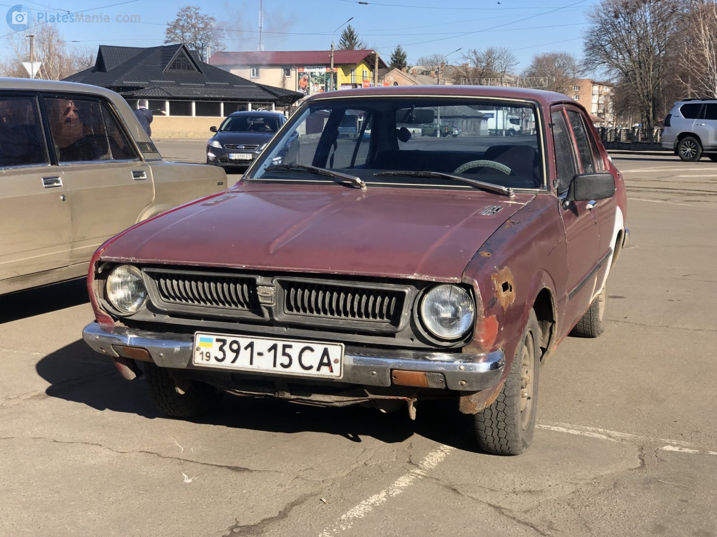 19 391-15 CA, Toyota Corolla 3rd gen 4-door Sedan (E30-E60), 1974–1979