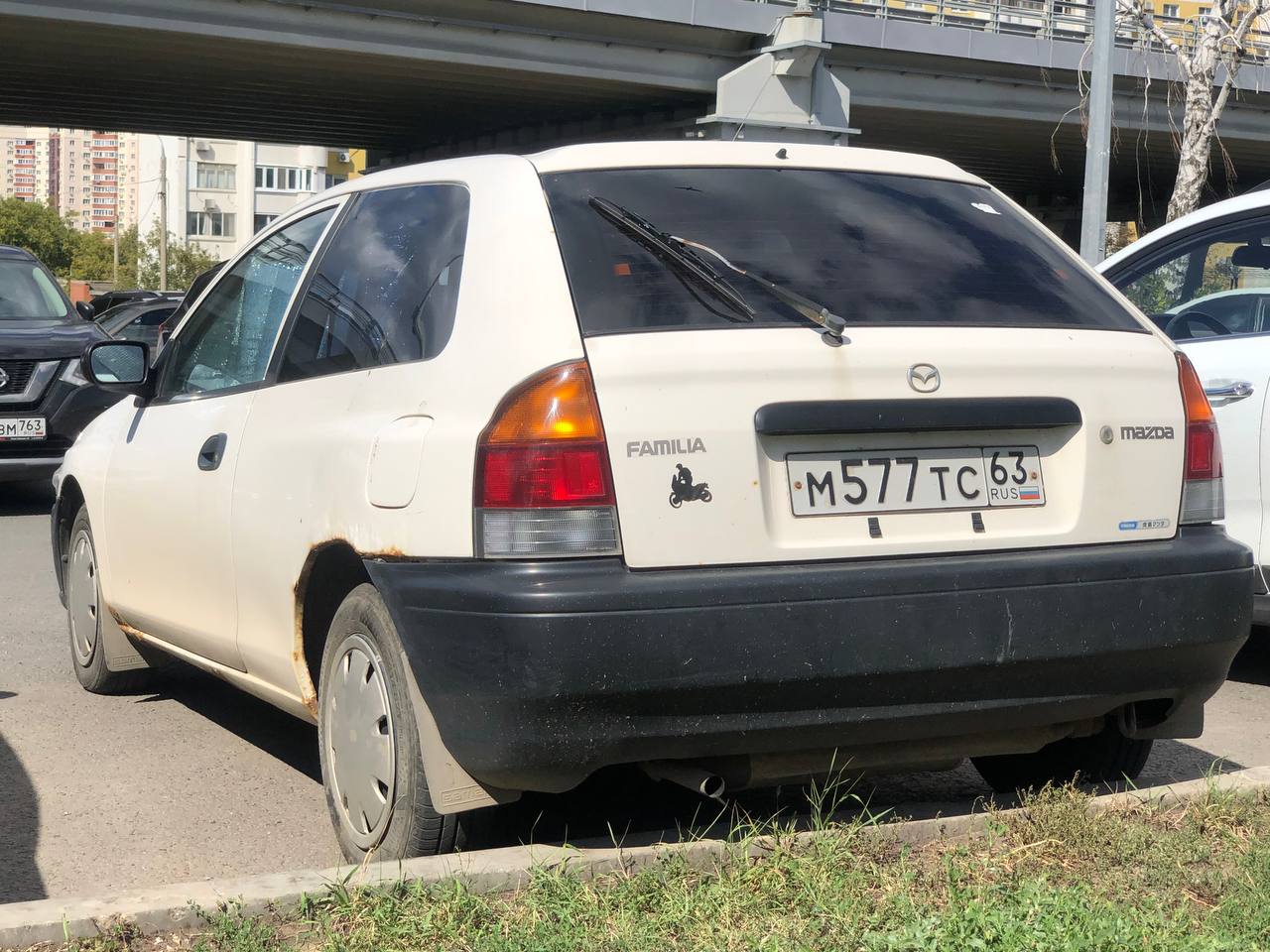 м 577 тс 63, Mazda Familia 7th gen Hatch (BH), 1996–1998