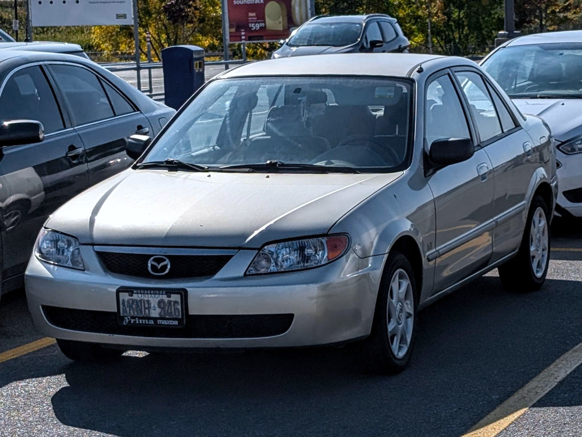 AKNH-946, Mazda Protegé 3rd gen Sedan (BJ; NA-market), facelift, 2000–2003