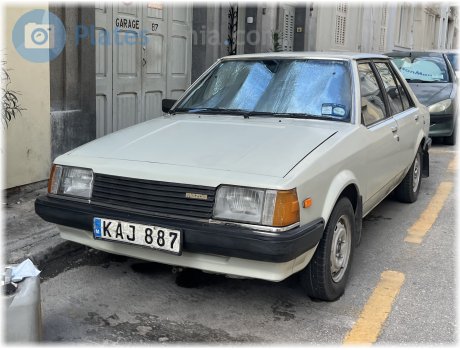 KAJ 887, Mazda 323