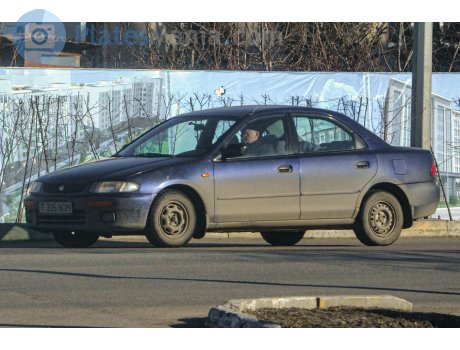 T 305 NOM, Mazda 323