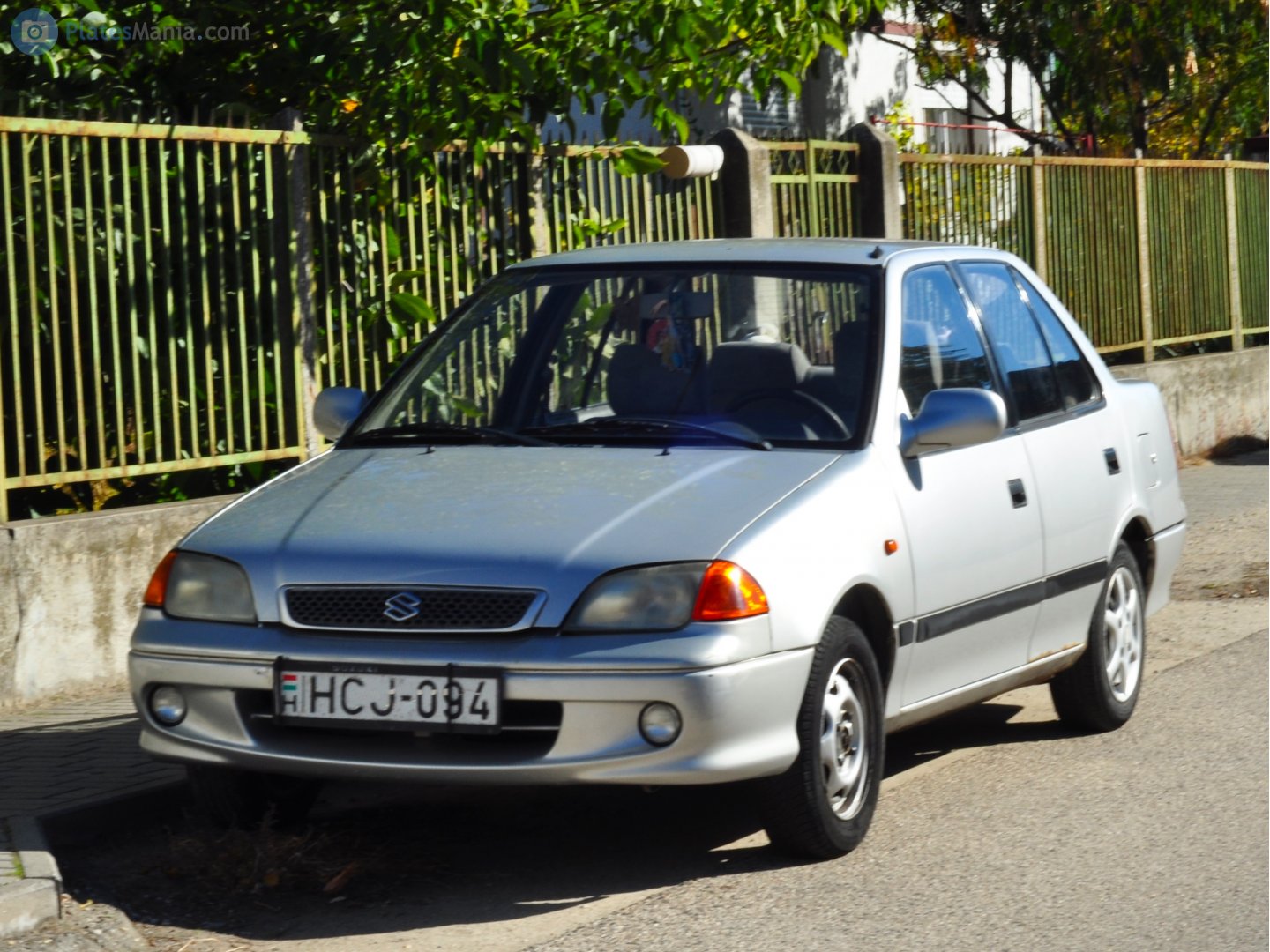 HCJ-094, Suzuki Swift 2nd gen Sedan (SF), facelift, 1996–2004