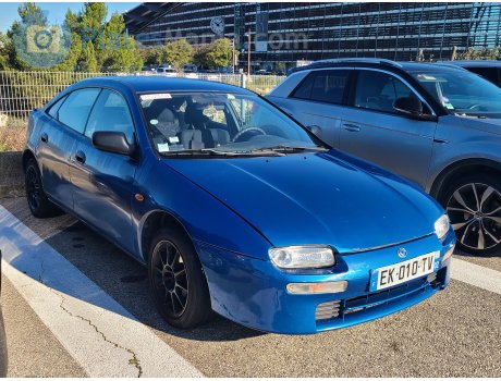 EK-010-TV, Mazda 323