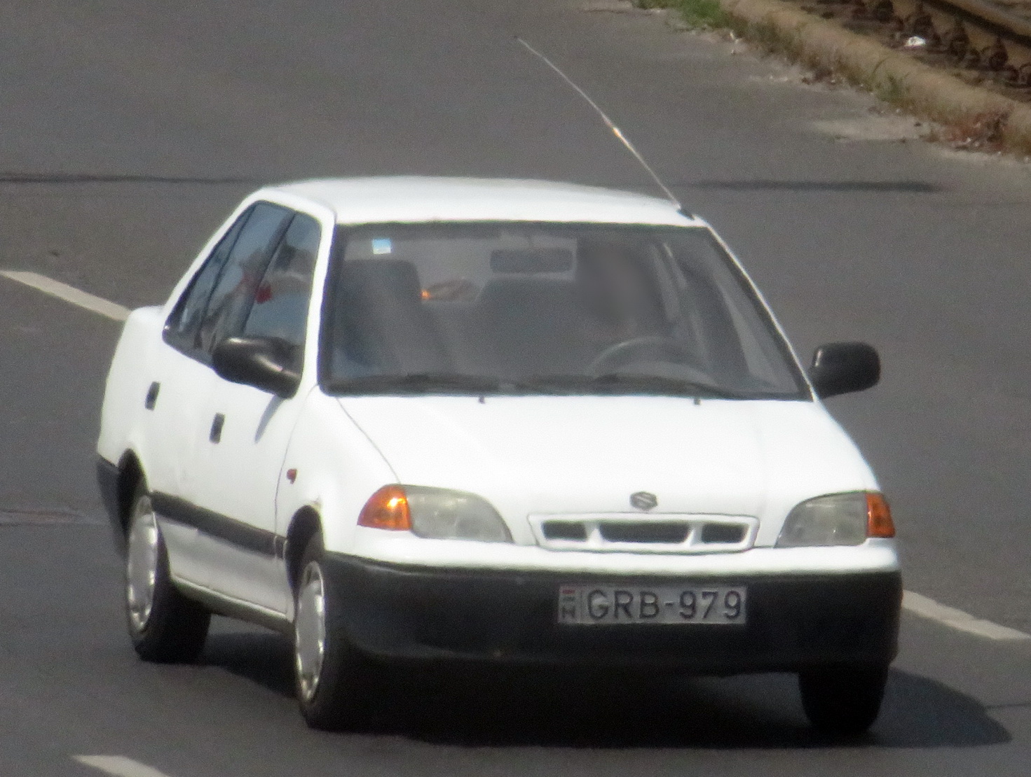 GRB-979, Suzuki Swift 2nd gen Sedan (SF), facelift, 1996–2004